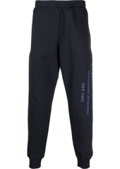 Alexander McQueen Graffiti-print cotton track pants