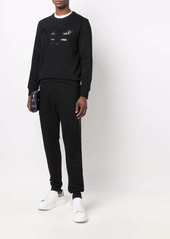 Alexander McQueen logo-print cotton track trousers