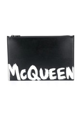 Alexander McQueen paint style logo clutch bag