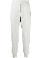 Alexander McQueen skull patch track trousers