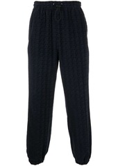 Alexander Wang monogram-embossed drawstring track pants