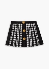 Balmain - Button-embellished pleated houndstooth jacquard-knit mini skirt - Black - FR 42