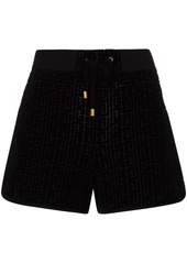 Balmain monogram-pattern velvet track shorts