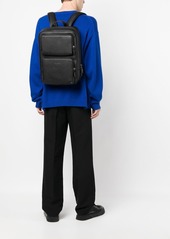 Coach multi-pocket leather backpack