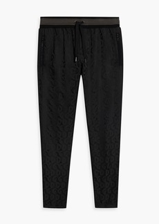 Dolce & Gabbana - Tapered logo-jacquard drawstring pants - Black - IT 50