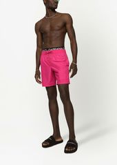 Dolce & Gabbana embossed-logo swimming shorts