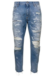 Dolce & Gabbana Light Blue Ripped Jeans with Logo Plaque in Cotton Denim Man