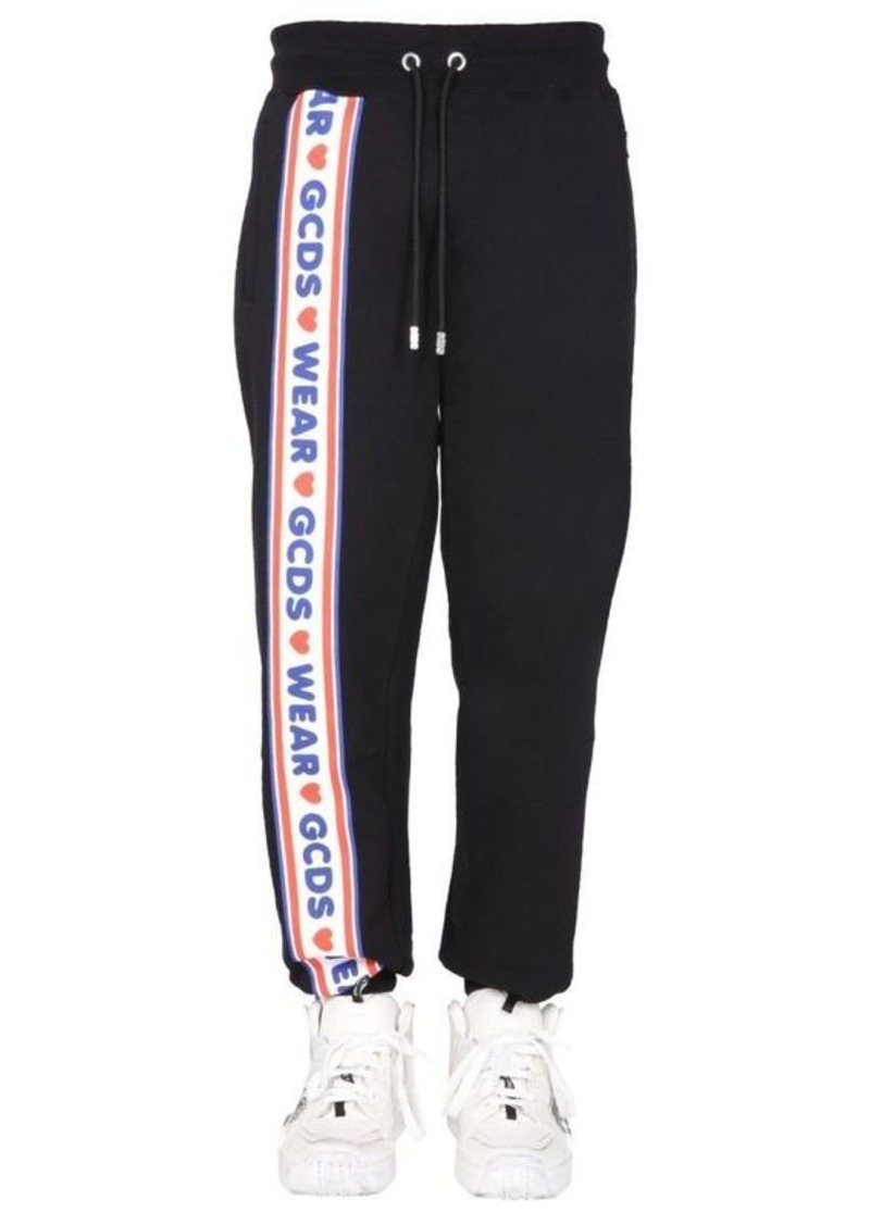 GCDS JOGGING PANTS WITH "CUTE TAPE" LOGO BAND