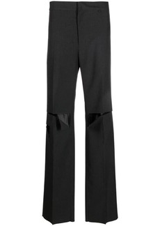 GIVENCHY Ripped wool trousers