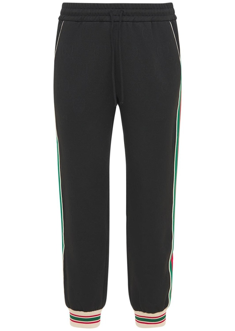 Tracksuit bottoms Gucci - GG detail tech jersey track pants