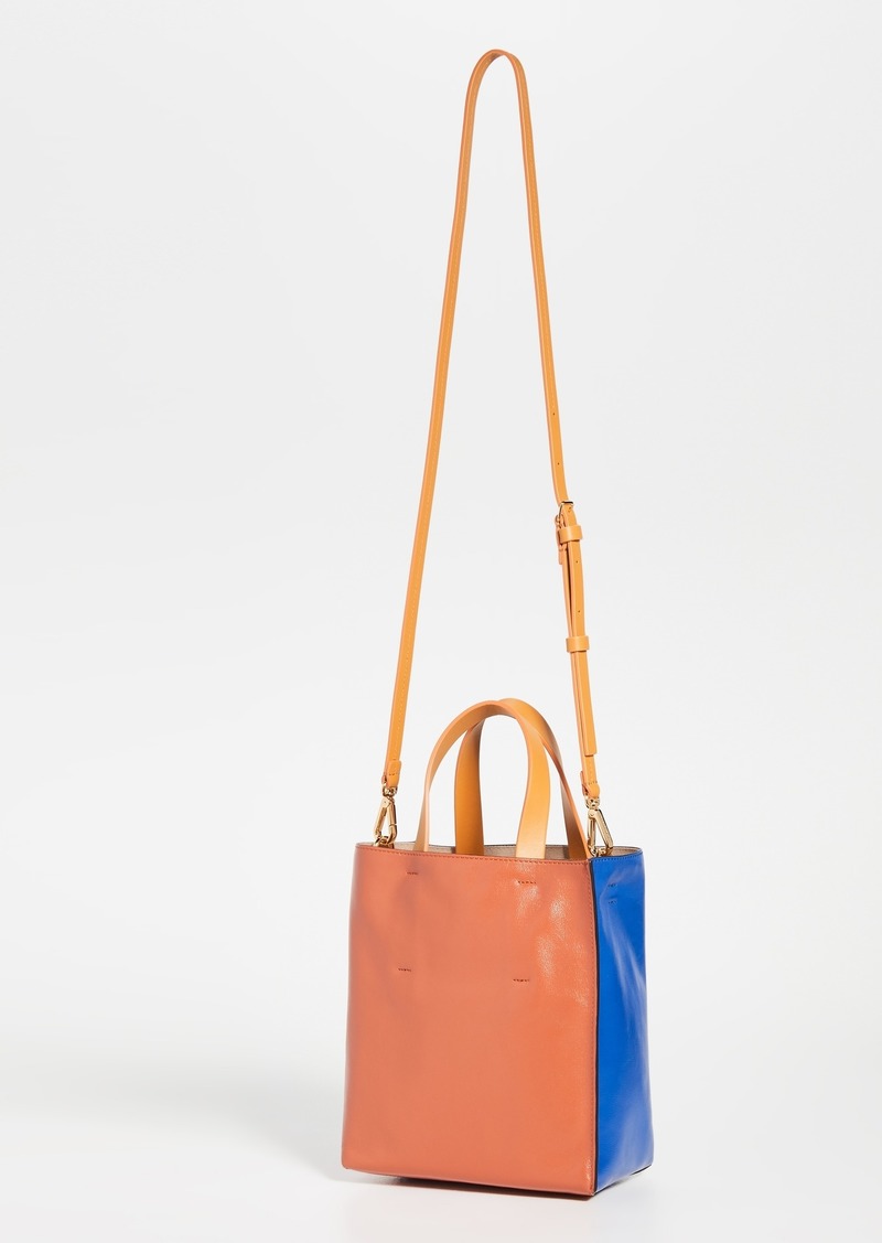 Tropicalia micro leather-trimmed fringed faux raffia tote