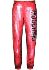 Moschino abstract-print branded track trousers