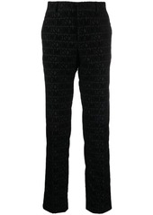 Moschino flocked-logo straight-leg trousers