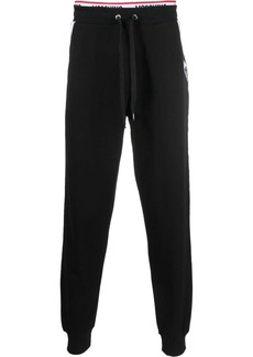 Moschino logo-waistband trousers