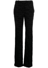 Moschino monogram-print tailored trousers