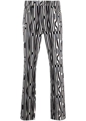 Moschino Warped Logo print slim-fit gabardine trousers