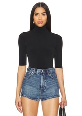 Norma Kamali Slim Fit Short Sleeve Turtleneck Top