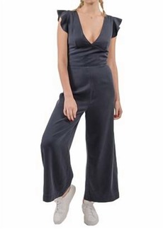 Pam & Gela Ruffle Sleeve Laced Back Jumpsuit in Navy