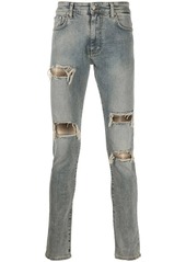 Represent distressed flannel-layered jeans