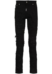 Represent ripped distressed skinny jeans