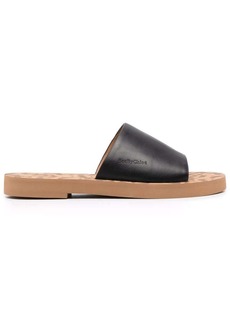 See by Chloé embossed-logo leather slippers