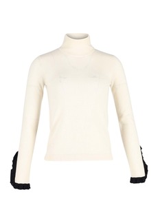 Temperley London Ruffled Sleeve Hem Turtleneck Top in Cream Cotton