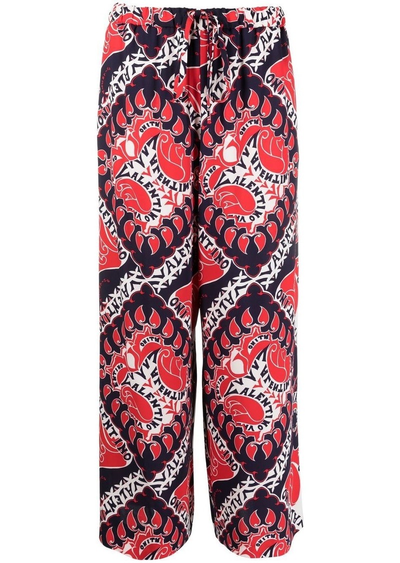 Valentino Archive Manifesto-print trousers