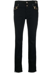 Versace decorative buckle skinny trousers