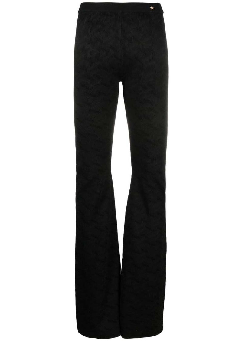 Versace Greca-knit flared trousers