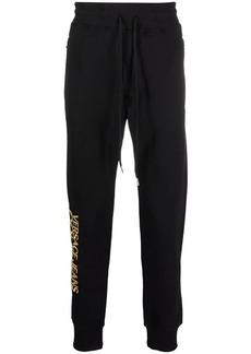 Versace logo-embroidered jersey trousers