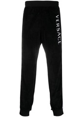 Versace logo stripe print track pants