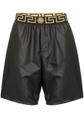Versace logo waistband swim shorts