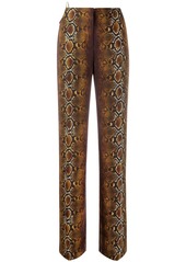 Versace python print ring-embellished trousers