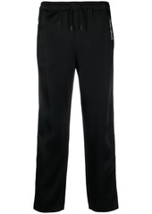 Yves Saint Laurent embroidered-logo striped track pants